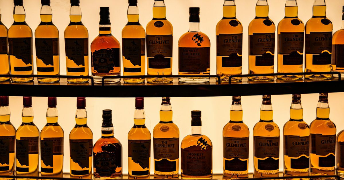 Whisky bottles on a back lit shelf