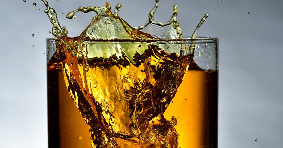 Whisky splashing in a glass
